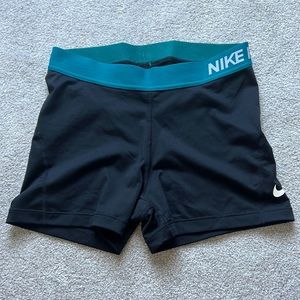Teal and Black Nike Pros